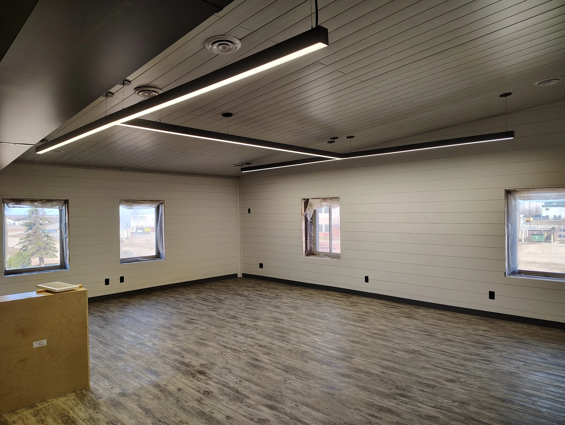 Finished custom interior with modern suspended linear LED lighting
