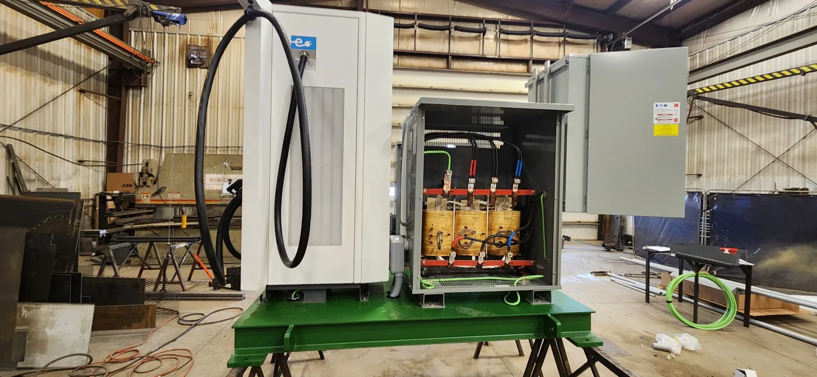 Industrial electrical equipment installation in a fabrication shop