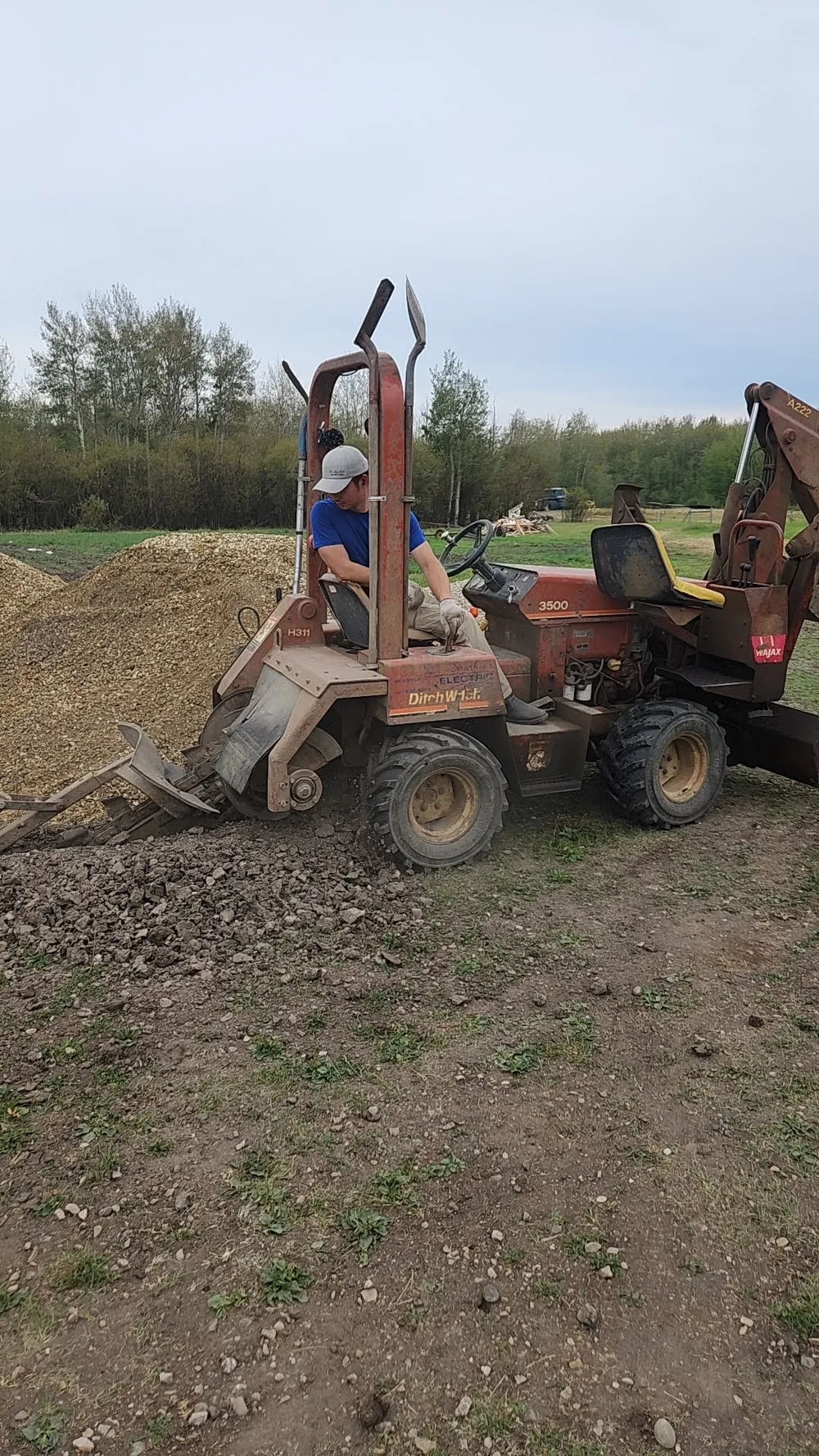 Rural underground electrical work using a trenching machine